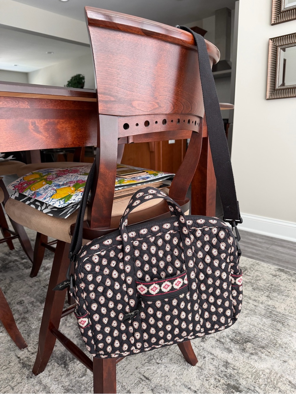 Quilted Black Vera Bradley laptop bag with adjustable strap